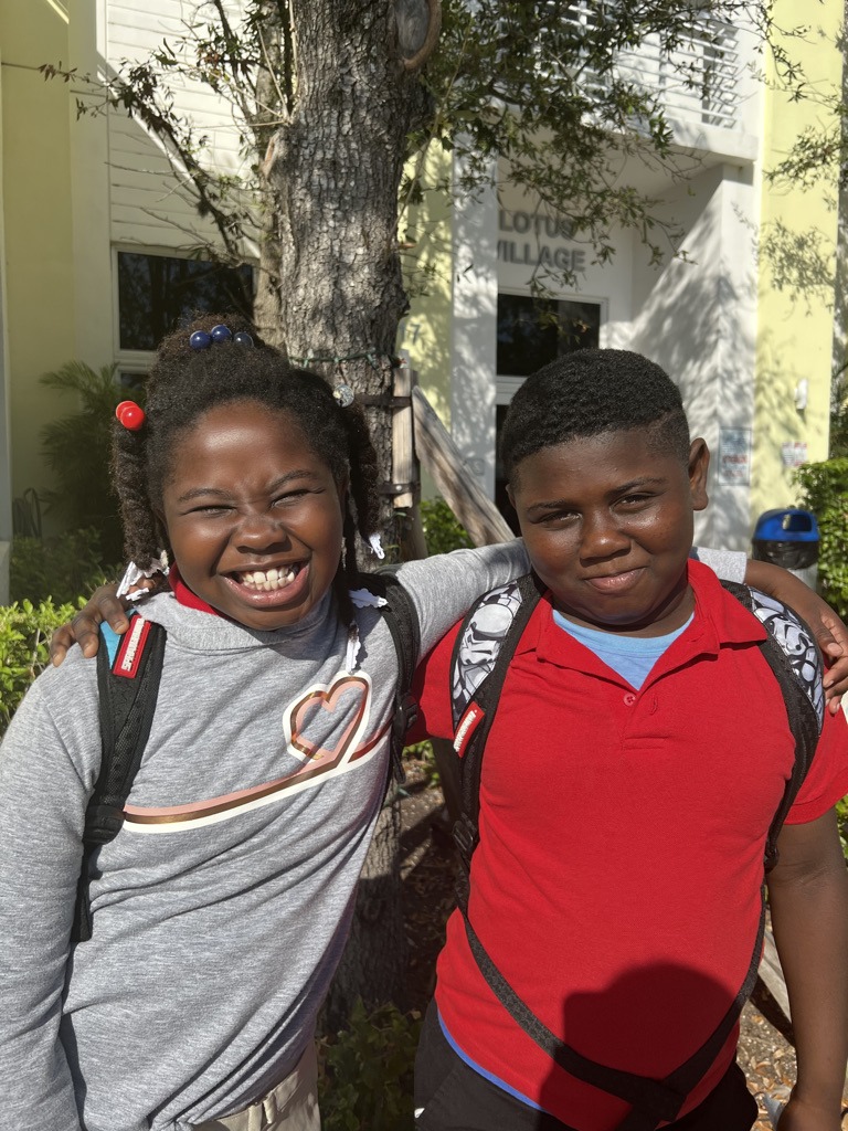 Two Lotus House children coming home from school.